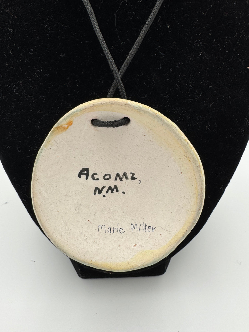 Hand-painted ceramic pendant by Marie Miller
